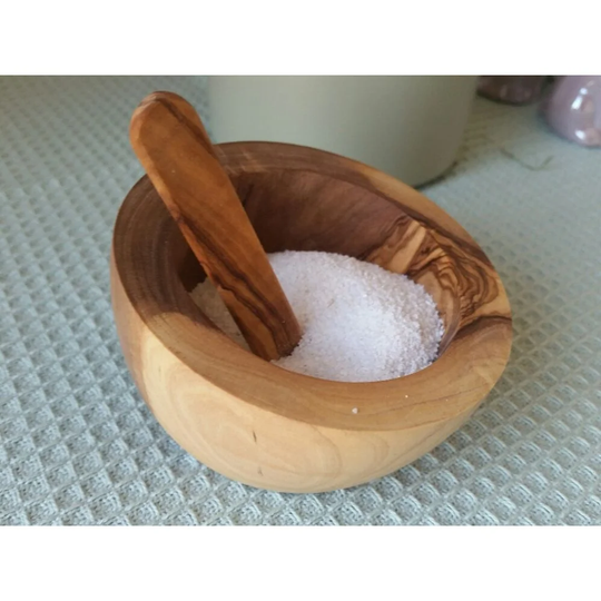 Angled salt barrel made of olive wood with a spoon