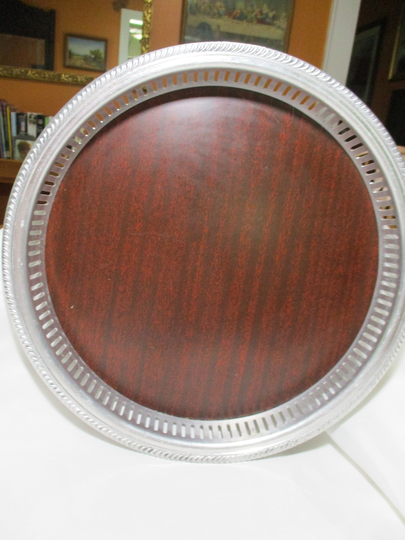 A Vintage Round Crescent Brand Serving Tray With Cherry Woodgrain Fromica Bottom